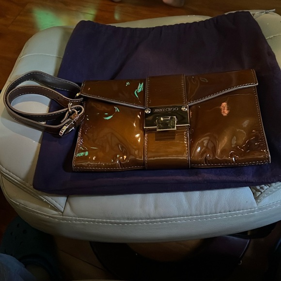 Jimmy Choo Handbags - Jimmy Choo patent leather clutch/wristlet worn maybe 2 times EXCELLENT CONDITION